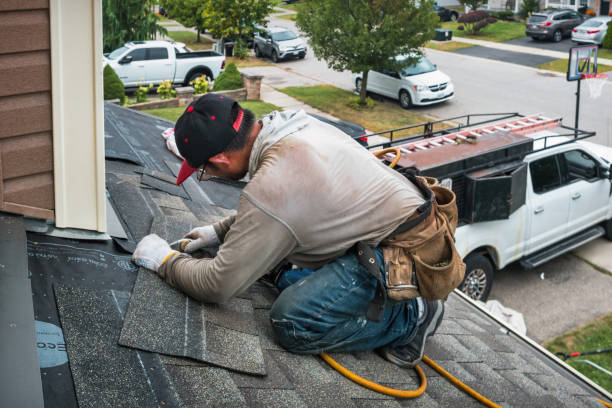 Professional Roofing technician working in Swan Lake, NY